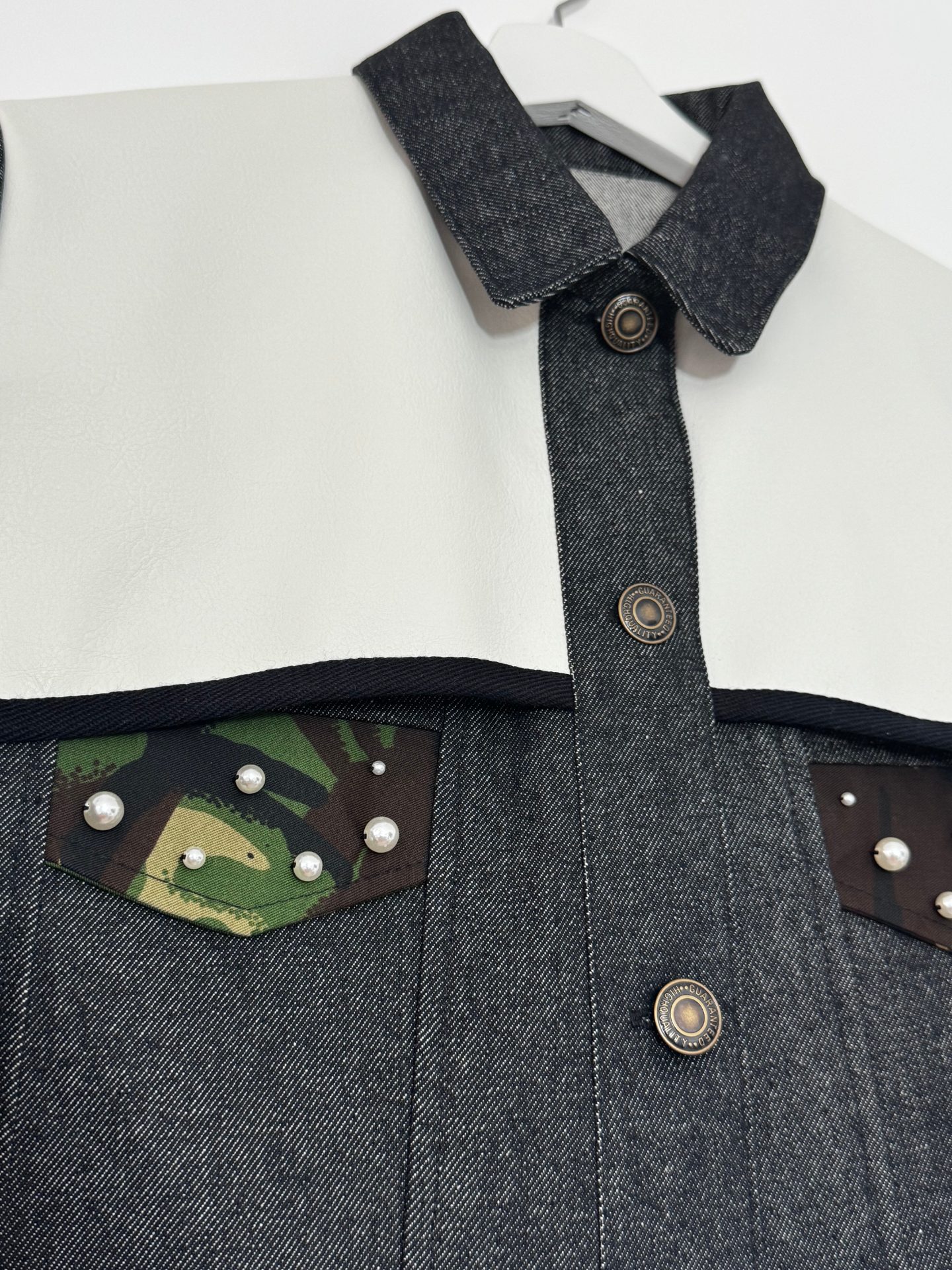 Pearl Armour Jacket — collar, placket and antique-brass button close-up